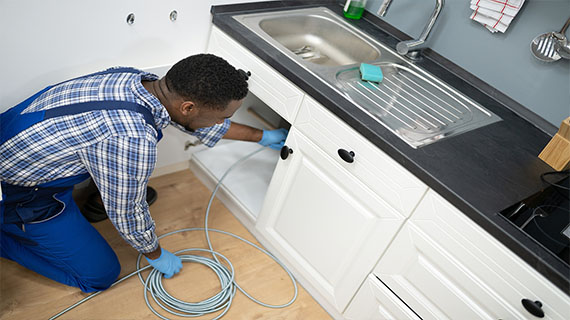 Plumbing fixes Technician checking plumbing system.