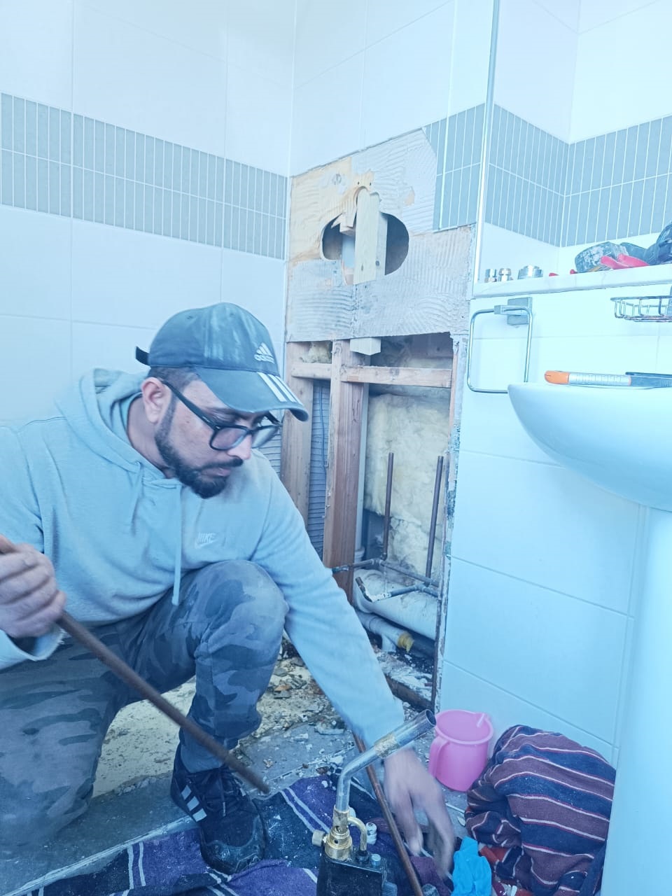 plumbing4 Plumbing technician installing and maintaining home pipe systems.