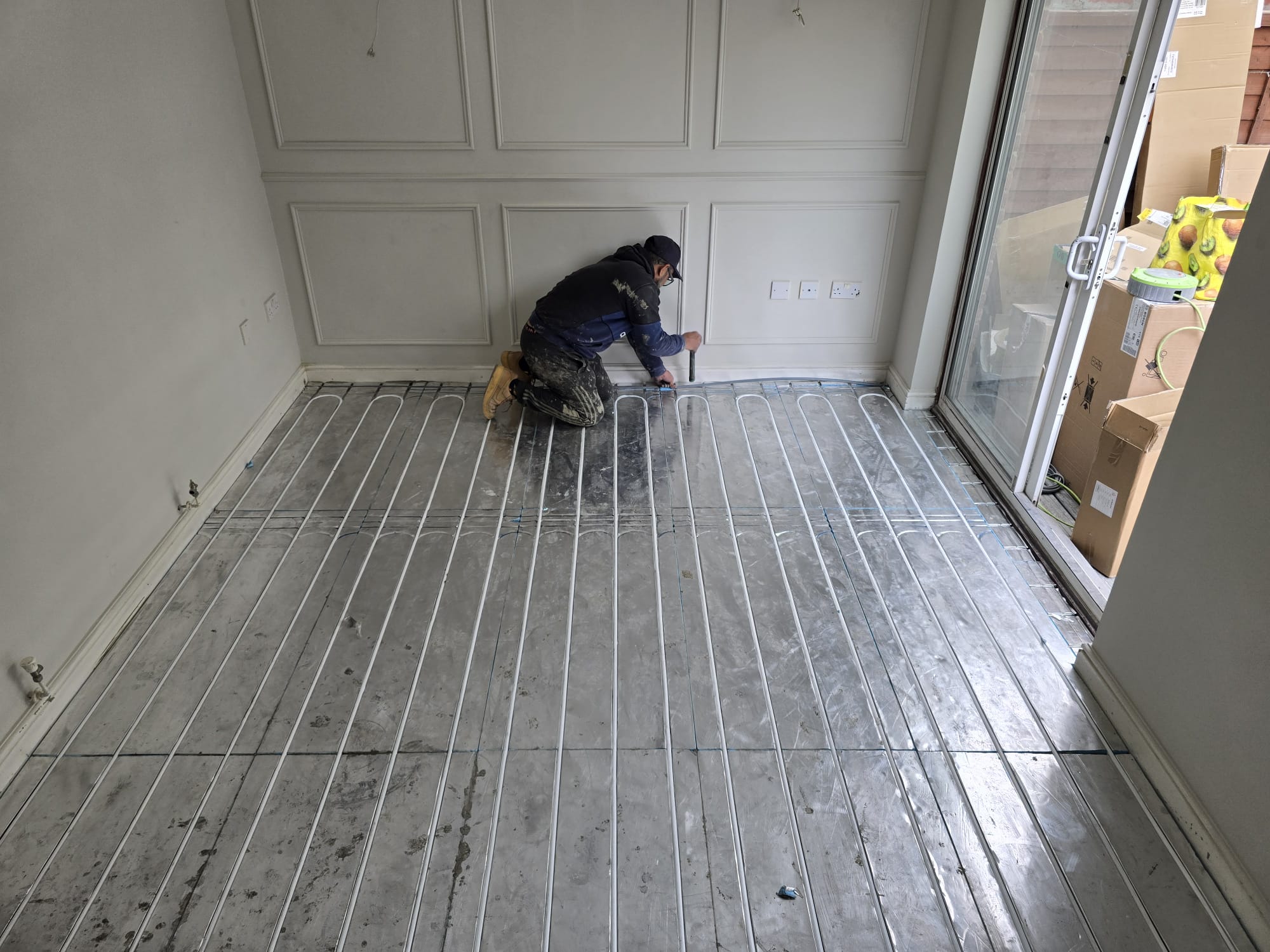 Underfloor heating setup with radiator installation service