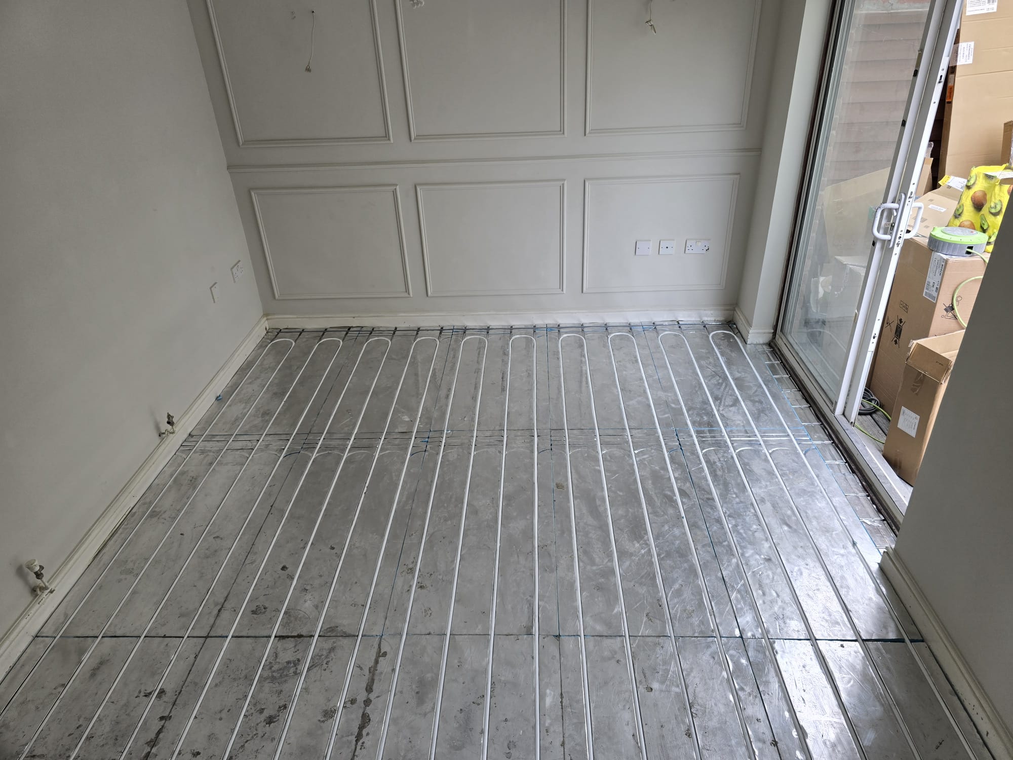 Modern radiator and underfloor heating system installation